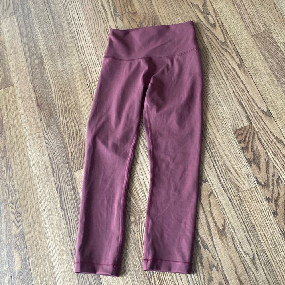 Mauve/ wine colored lululemon leggings.